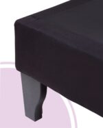 Detalle del tapiz en lino negro y pata de madera de la base de cama Fiorenza